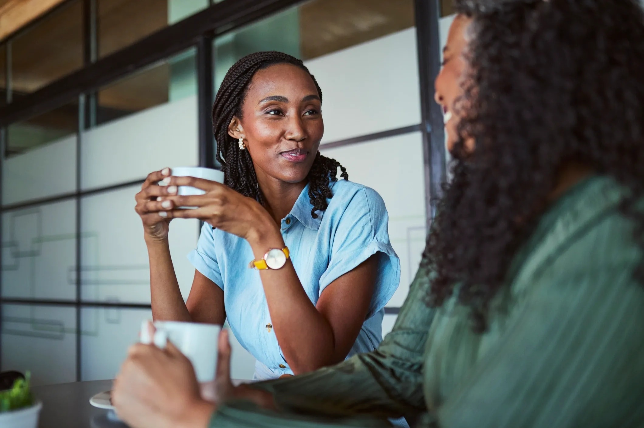 Women in warm conversation, mentoring and connecting